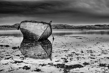 gray wooden boat on the body of warer thumbnail