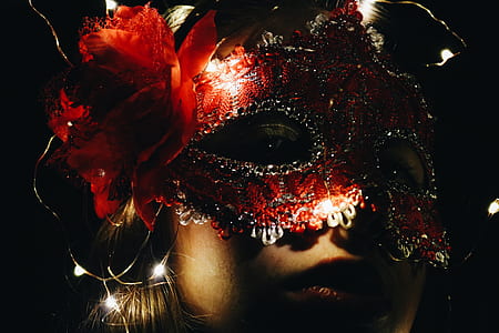 woman wearing silver and red floral masquerade mask thumbnail