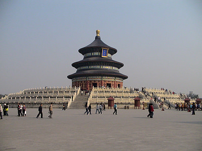 people walking near concrete structure thumbnail