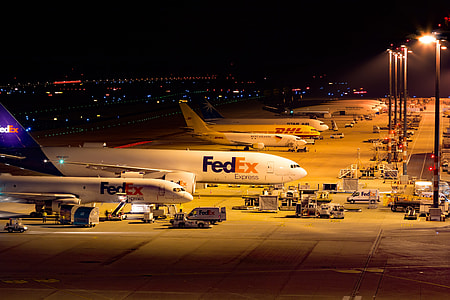 FedEx airliner near turned-on light post thumbnail
