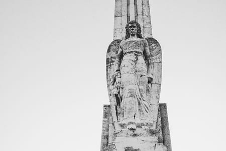 grayscale photo of angel concrete statue thumbnail