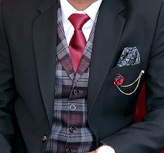 Man Wearing Black Notched Lapel Suit Jacket thumbnail