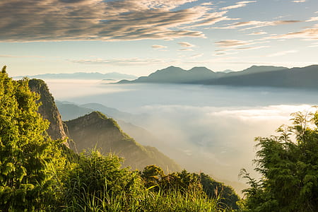 silhouette of mountains under white and blue cloudy sky thumbnail