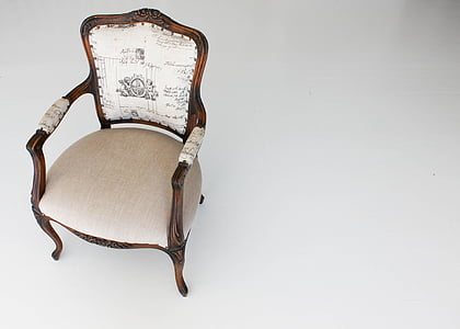 photo of brown wooden framed white padded armchair thumbnail
