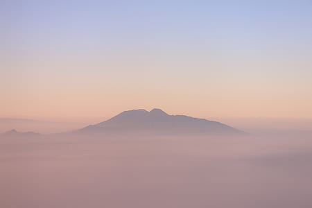mountain range covered by clouds thumbnail