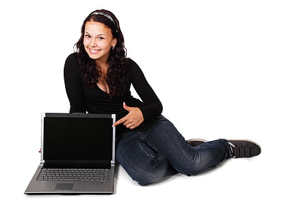 woman sitting on floor beside laptop computer thumbnail