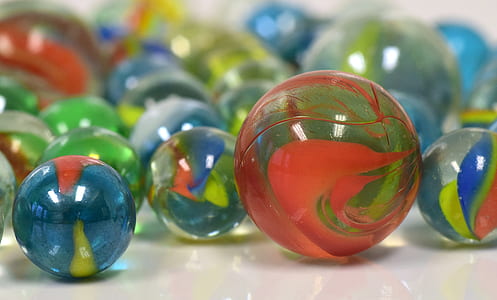 selective focus photography of marble toys thumbnail