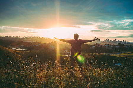 Person Spreading Hands Against Sun thumbnail