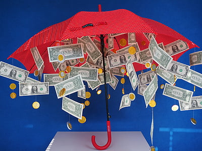 red umbrella with hanged US dollar banknotes thumbnail