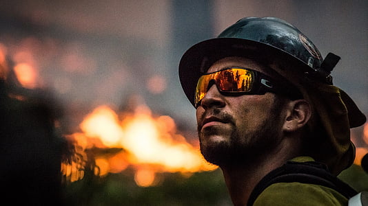 man wearing black half helmet and brown goggles thumbnail