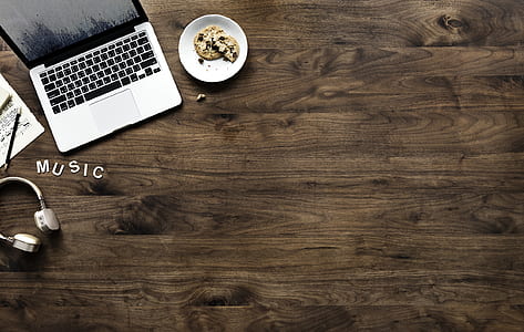 MacBook Pro on brown table thumbnail