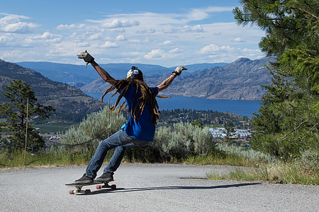 person riding longboard downhill thumbnail