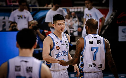 two basketball players hold hands thumbnail