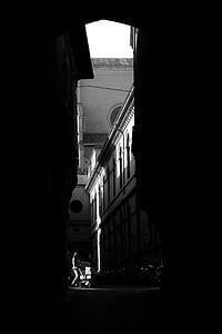 woman pushing stroller near building thumbnail