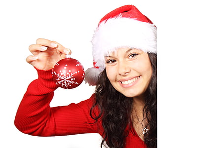 photo of woman wearing Christmas-themed tops and bubble hat holding ball thumbnail