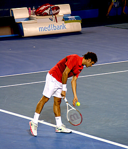 photo of man picking up tennis ball thumbnail
