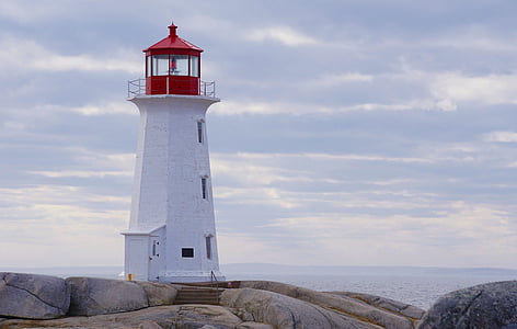 white and red lighthouse near in sea thumbnail