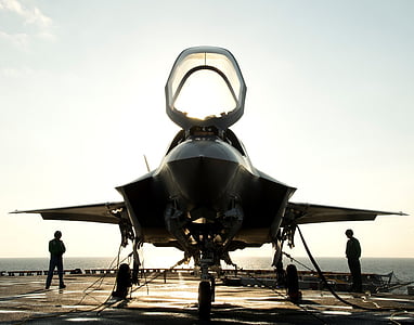 gray plane under clear blue sky during golden hour thumbnail
