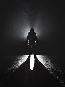 silhouette of person standing under the rain thumbnail