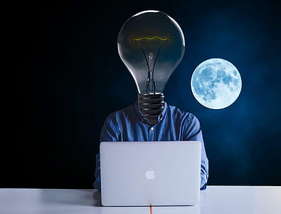 person light-bulb head in front of silver MacBook with full moon background thumbnail