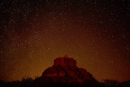 nebula over rock formation thumbnail