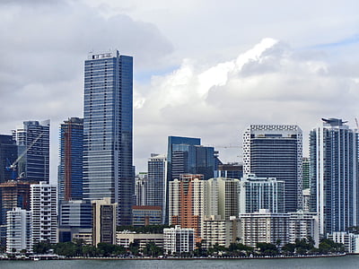 assorted buildings near body of water thumbnail