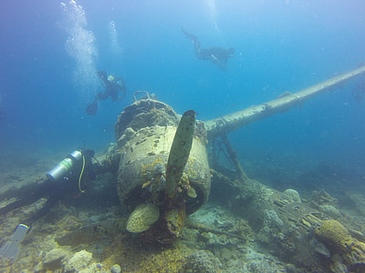 three divers swam on propeller plane underwater thumbnail