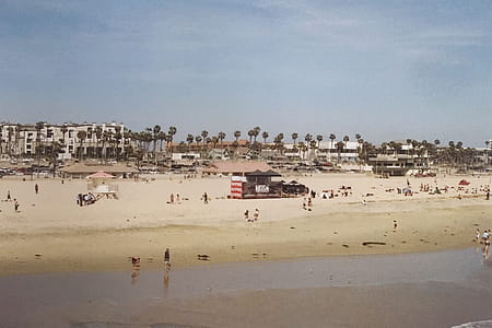 Brown Wooden Guard House Surrounded People on Beach thumbnail