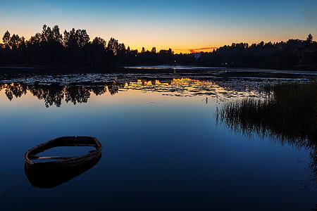 boat on body of water during golden hour thumbnail