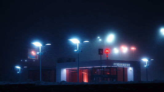 white concrete building and white street lights during nighttime thumbnail