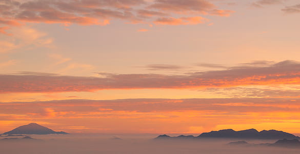 mountains covered with fog during sunset thumbnail