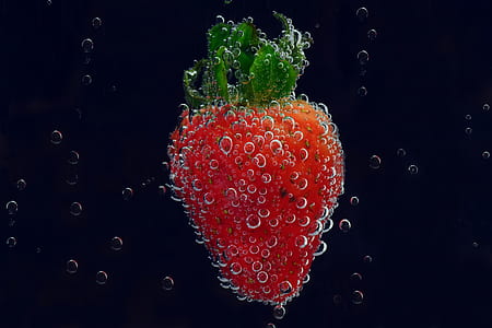 red strawberry fruit surrounded with bubbles under water thumbnail