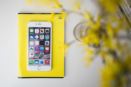 White smartphone with yellow flowers thumbnail
