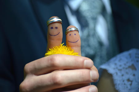 person showing silver-colored rings thumbnail