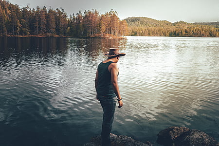 man standing on rock thumbnail