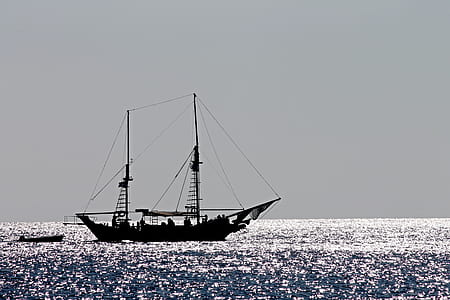 silhouette photo of boat thumbnail