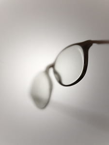 black framed eyeglasses on white surface thumbnail