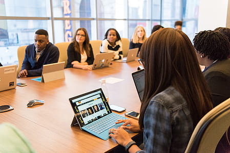 Group of People Sitting Near Table thumbnail
