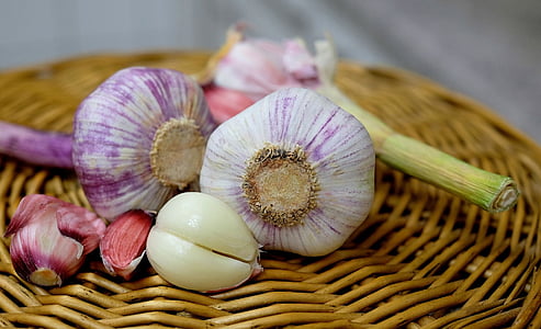 bulb of garlic on wicker brown basket thumbnail
