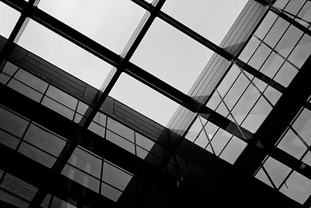 glass window paneled building under clear sky thumbnail