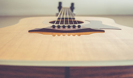 close-up photo of brown acoustic guitar thumbnail