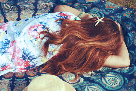 woman in teal,red,and,white floral print sleeveless dress thumbnail