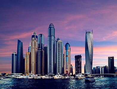 cityscape on body of water during sunset thumbnail