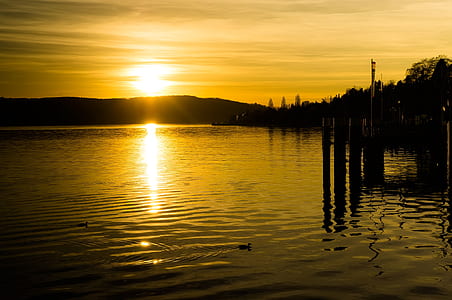 body of water across silhouette of mountain thumbnail