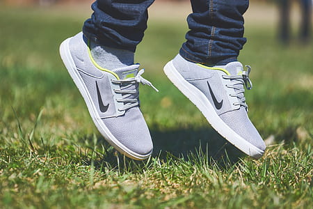 pair of grey Nike sneakers thumbnail