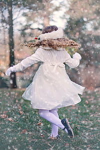 woman wearing white dress walking on green grass thumbnail