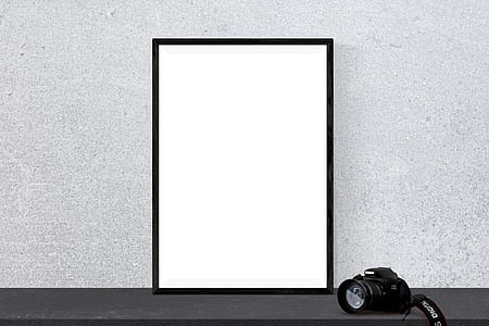 black DSLR camera thumbnail