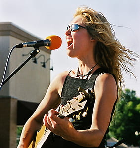 woman playing guitar thumbnail