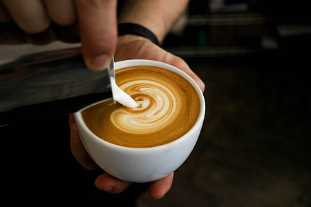 white ceramic teacup with latte thumbnail
