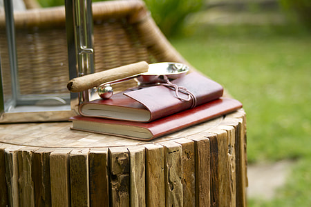 two red covered books on table thumbnail